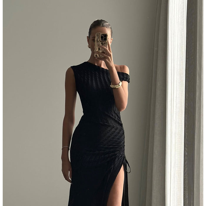 Female model wearing black off shoulder side split maxi dress