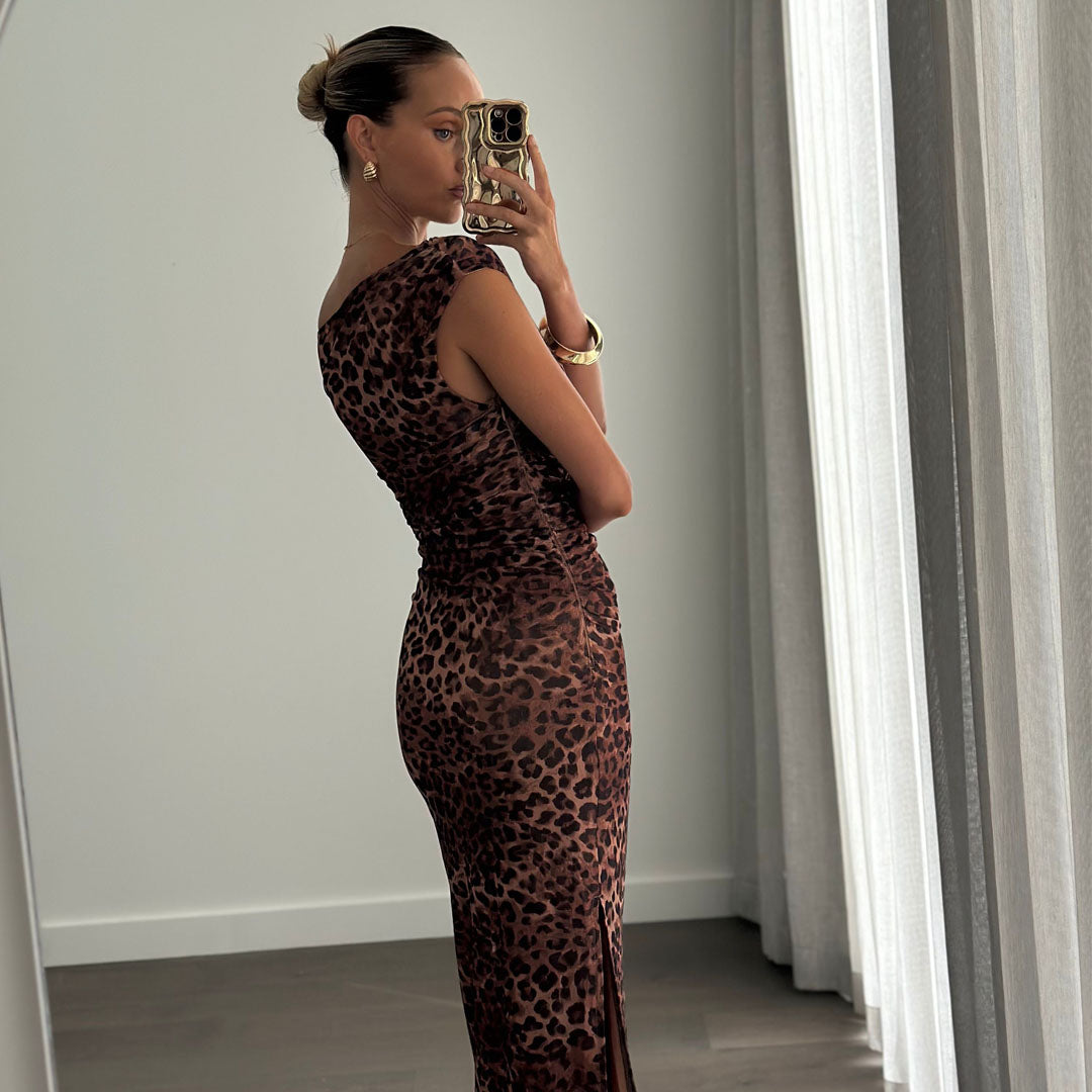 Female model wearing off shoulder fitted leopard print midi dress online