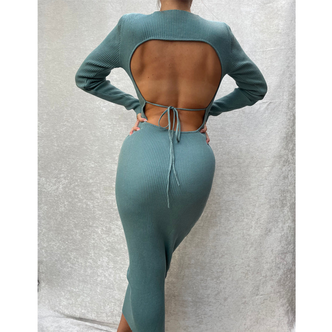 Female model wearing teal long sleeve bodycon open back midi dress