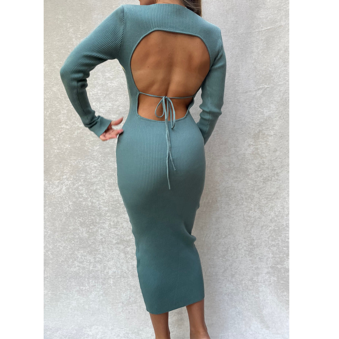 Female model wearing teal long sleeve bodycon open back midi dress