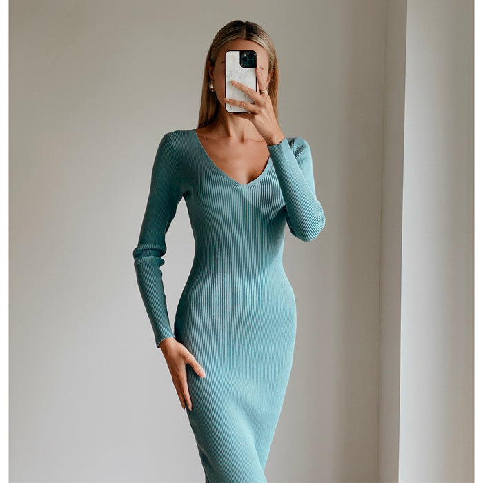 Female model wearing teal long sleeve bodycon open back midi dress
