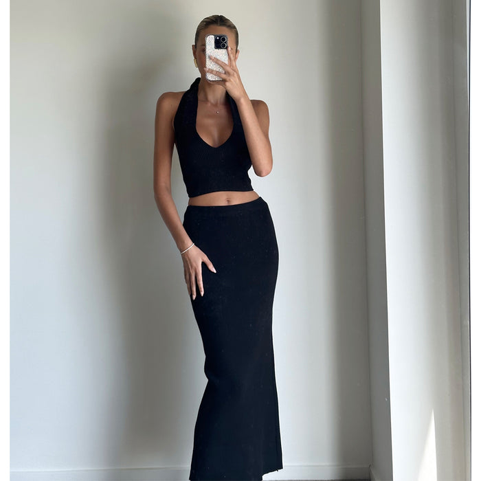 Female model online wearing black mid waist knit midi skirt