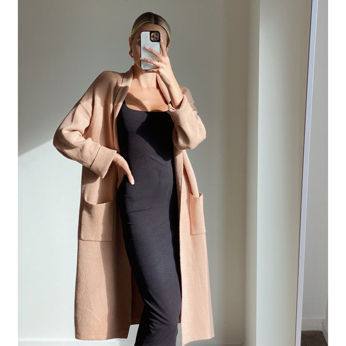 Female model online wearing camel long sleeve midi knit cardigan