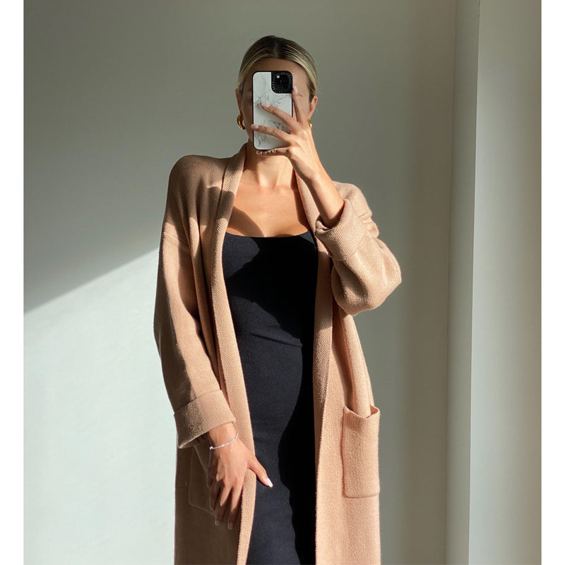 Female model online wearing camel long sleeve midi knit cardigan