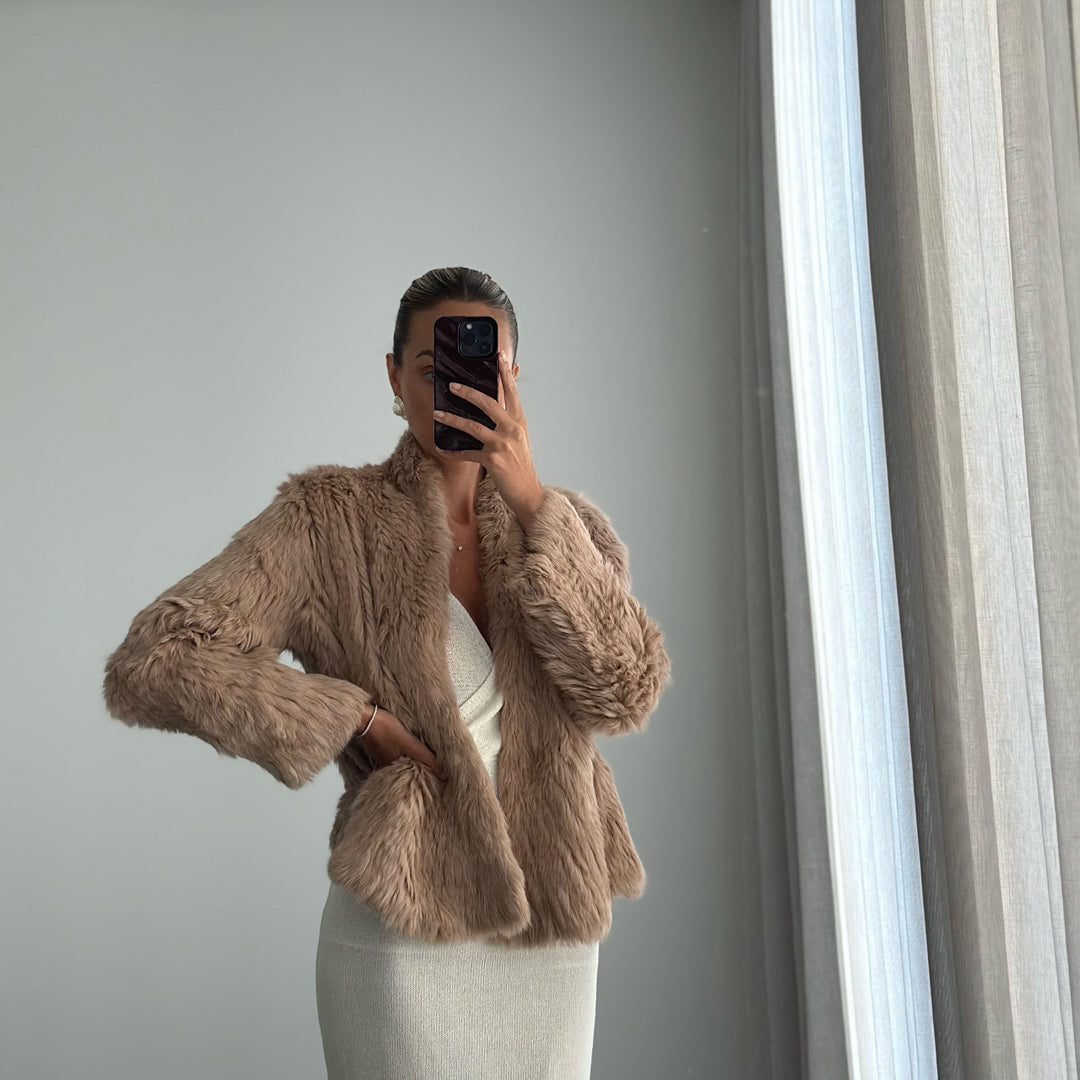 Female model wearing caramel long sleeve fur jacket online 