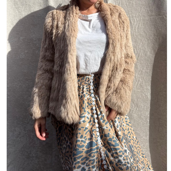 Female model wearing caramel fur jacket online 