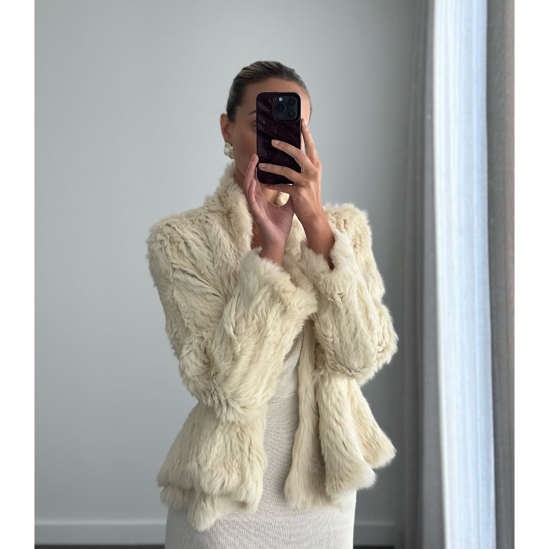 Female model online wearing long sleeve ivory fur jacket 