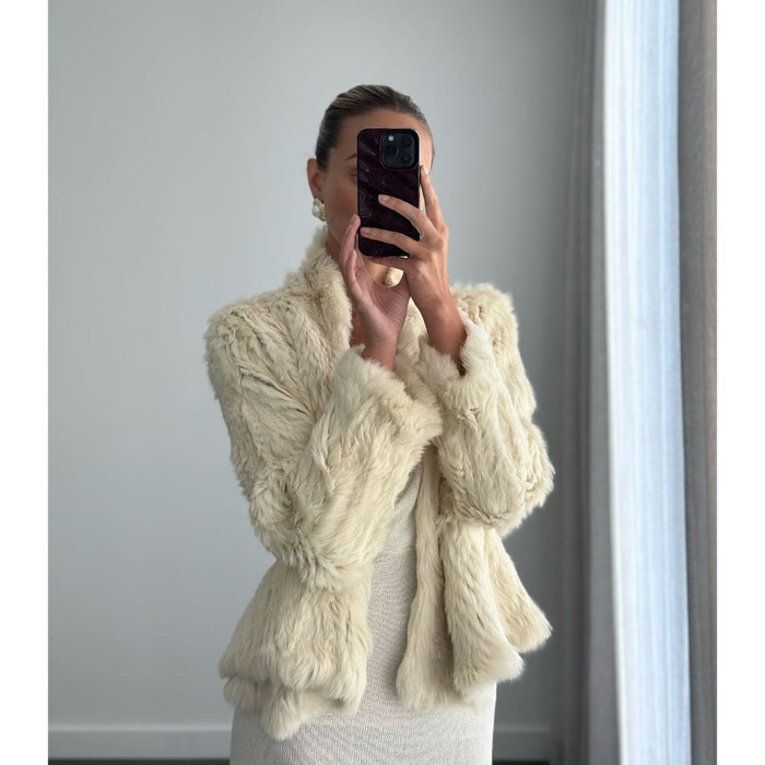 Female model online wearing long sleeve ivory fur jacket 