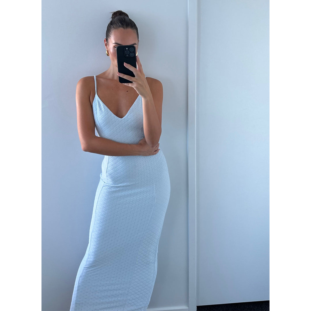 Female model wearing light blue texture bodycon strappy midi dress online
