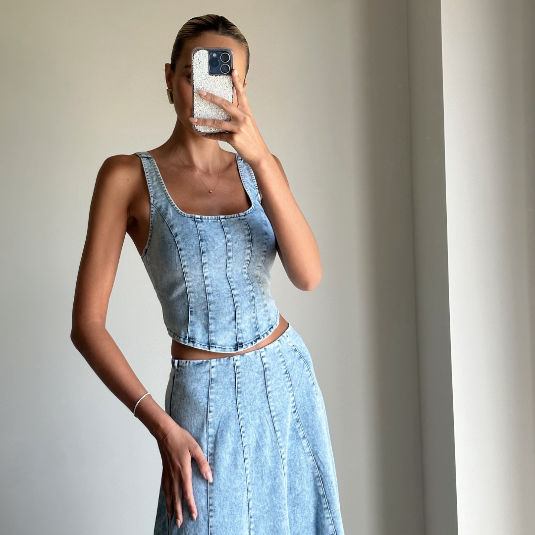 Model wearing light denim bustier crop top online