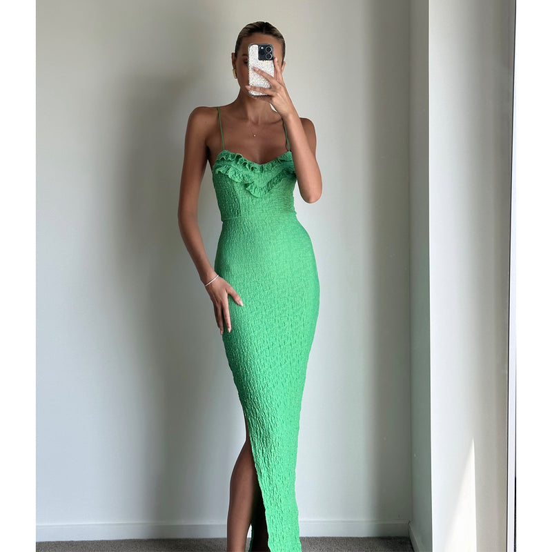 Female model online wearing vibrant green strappy bodycon midi dress