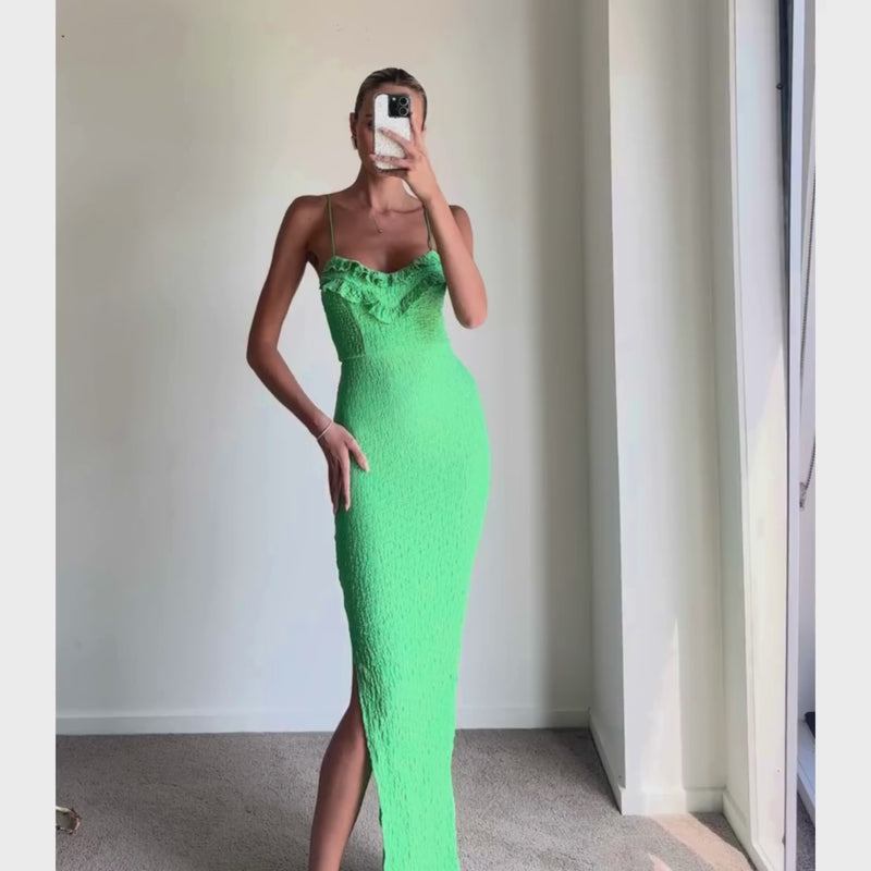 Female model online wearing vibrant green strappy bodycon midi dress