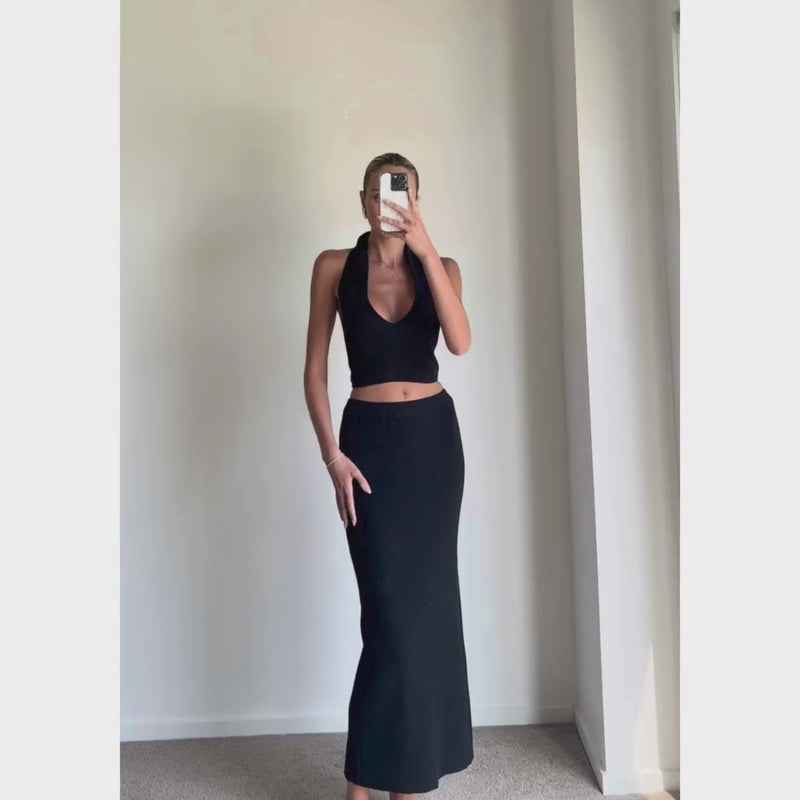 Female model online wearing black mid waist knit midi skirt