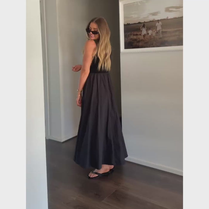 Woman wearing TEODORA black high neck midi dress — 
Matea Designs Australian lifestyle brand