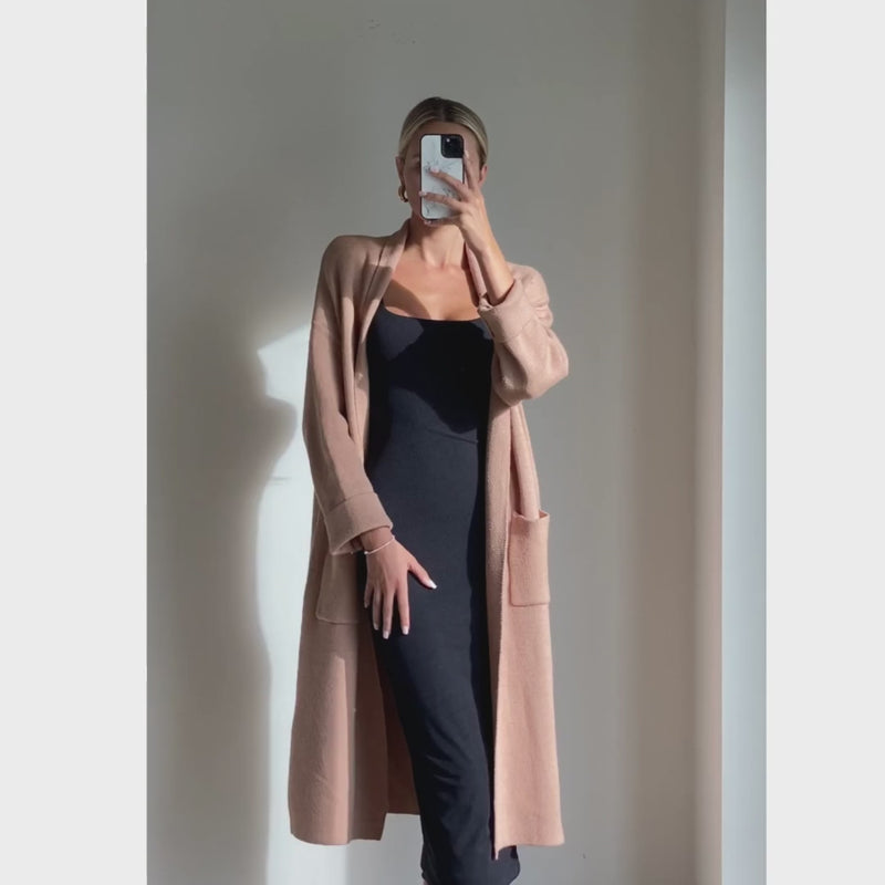 Female model online wearing camel long sleeve midi knit cardigan