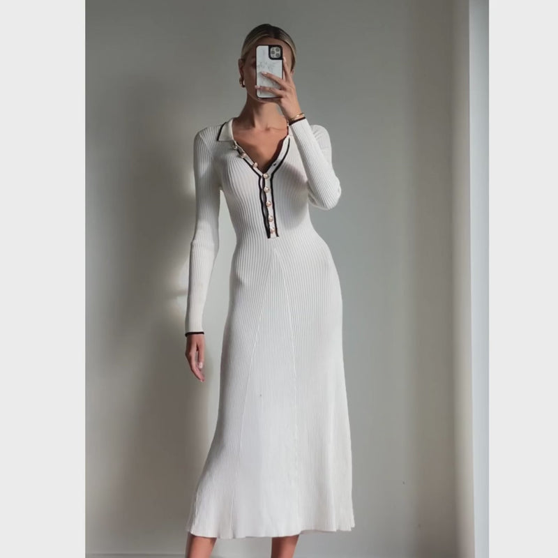 Female model wearing ivory knit long sleeve midi dress