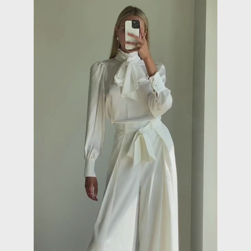 Woman wearing designer white sleeve shirt online