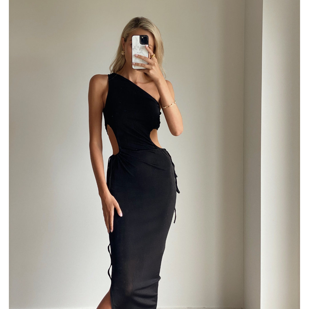 Female model online wearing black one shoulder side cut out maxi dress