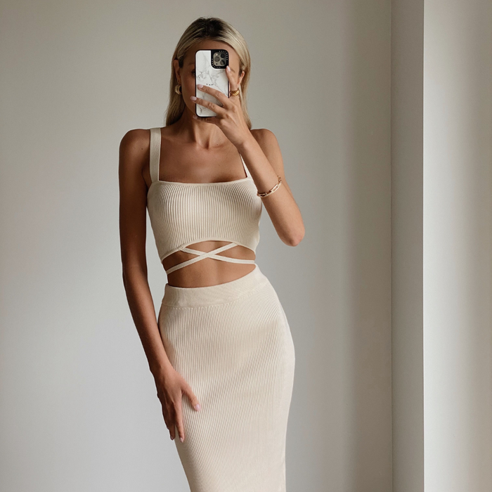 Female model wearing cream knit crop top online
