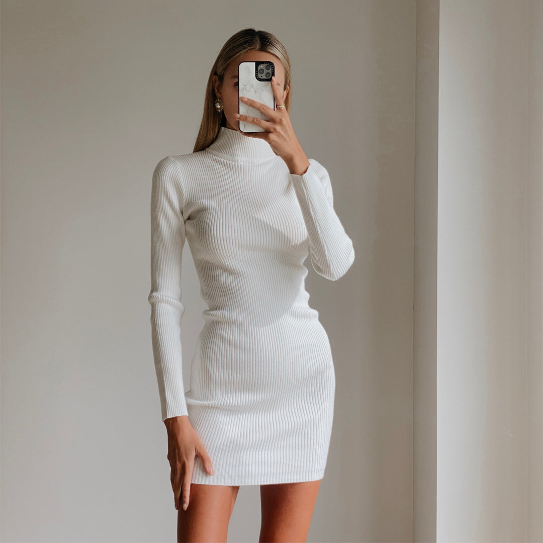 Female model wearing white high neck long sleeve bodycon mini dress