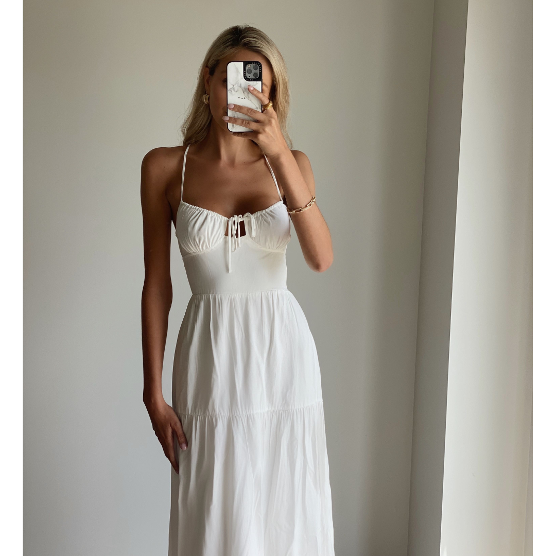 Female model online wearing white strappy flowy maxi dress