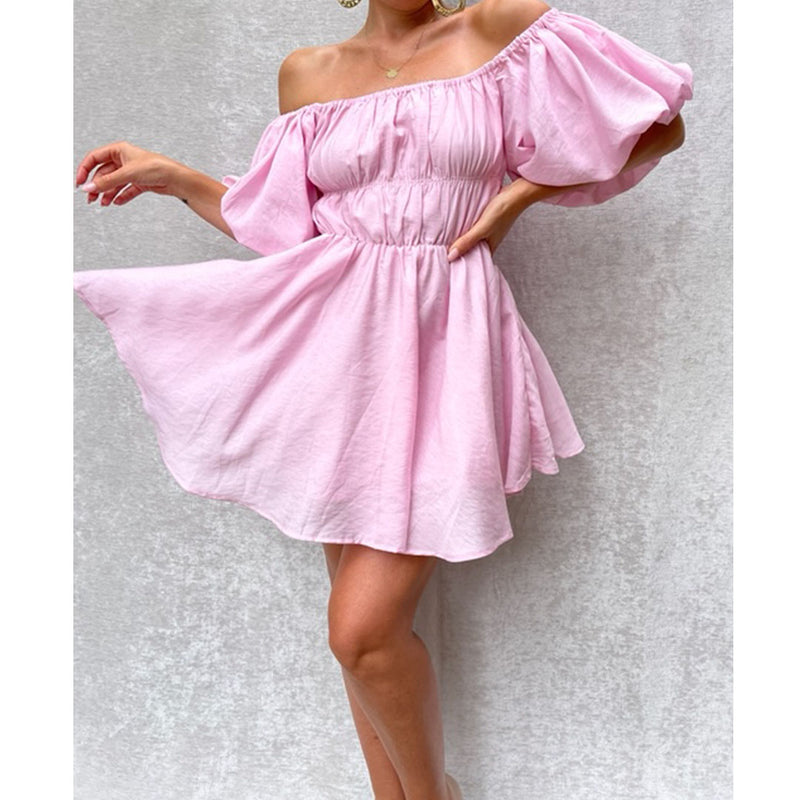 Female model wearing pink mini flowy dress