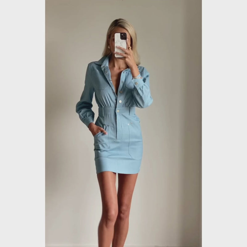 Female model online wearing long sleeve light denim mini dress
