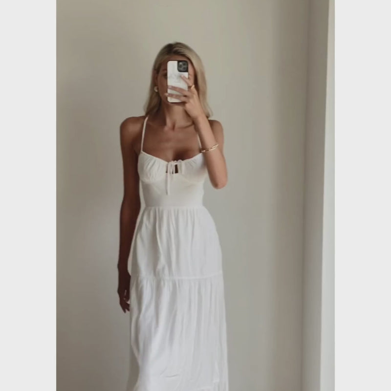 Female model online wearing white strappy flowy maxi dress